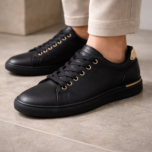 Black Low-Top Sneakers with Gold Hardware